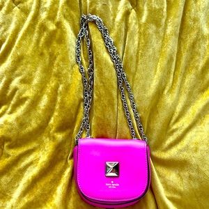 Pink Kate Spade micro purse with convertible chain
